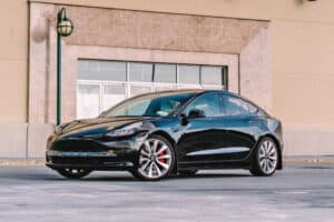 A black Tesla Model 3.