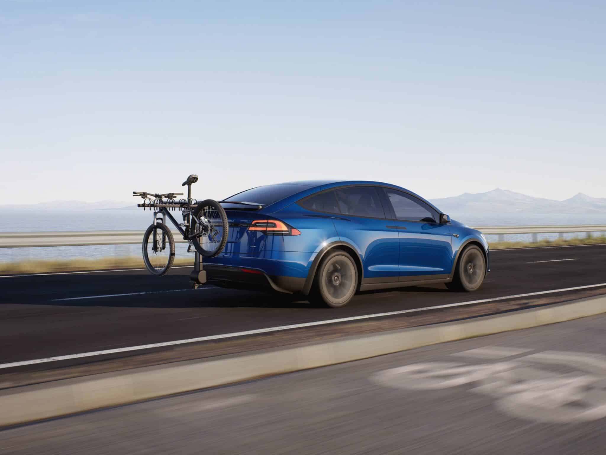 Tesla Model X carrying a bike on a rack.